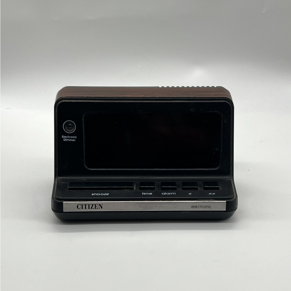 Vintage Citizen Black and Brown Portable Electronic Clock With Woodgrain